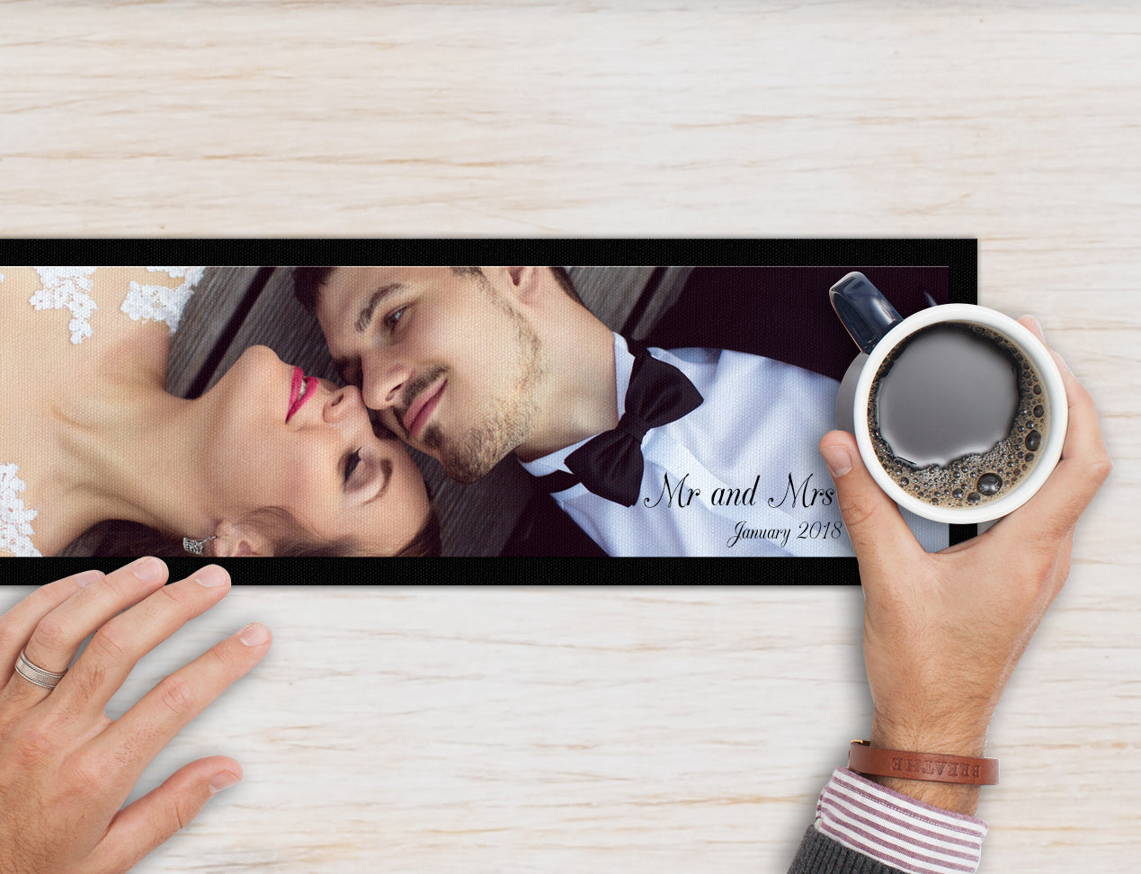 A personalised long bar mat that is customised with an image of a couple and the name and wedding date.