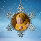 Custom Xmas decoration personalised with a baby in a yellow outfit against a snowy background