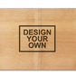A natural bamboo chopping board with 'DESIGN YOUR OWN' text engraved on it