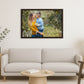 Framed photograph of a couple embracing on a wall above a sofa in a living room.