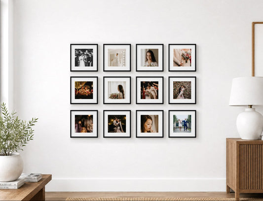 A 3x4 grid of twelve framed photo tiles on Diamond Photo Australia. The black-and-white and color photographs hang on a white wall in a styled interior room with a window, plant, lamp, and wooden cabinet.