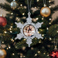 Decorative personalised star Christmas ornament with family photo on a Christmas tree