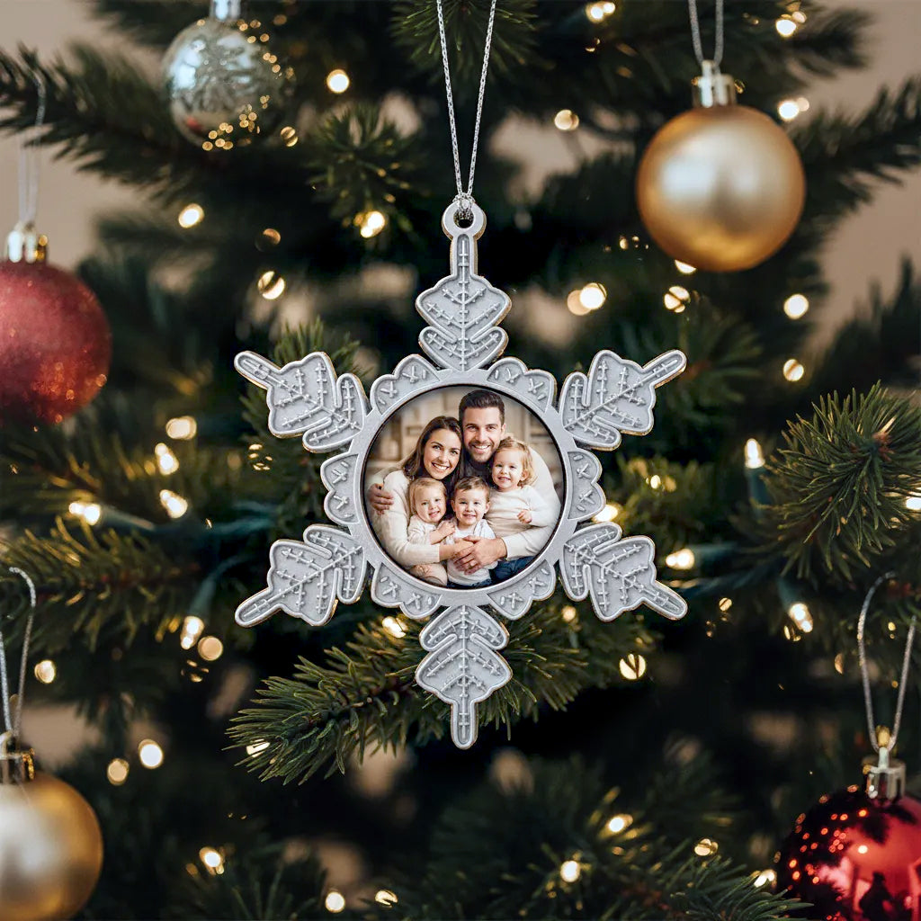 Decorative personalised star Christmas ornament with family photo on a Christmas tree