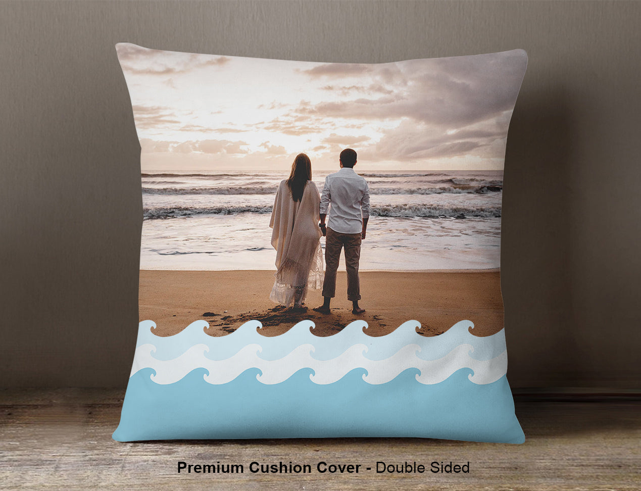 A custom cushion cover with a image of a couple on a beach with some wave design elements in front. This is the premium version which is also double-sided printed