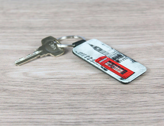 A custom keyring with a leather-look keychain featuring a printed image of a famous red London phone box.