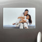 A custom porcelain magnet with a photo of a family printed on it, adhered to a metallic surface.