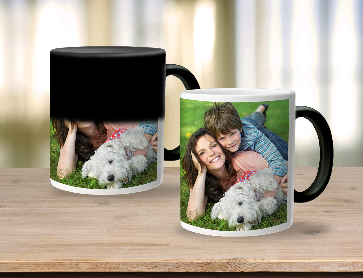 Magic Mugs on display on a table - these mug will change the colour when pouring hot water inside to reveal a family image